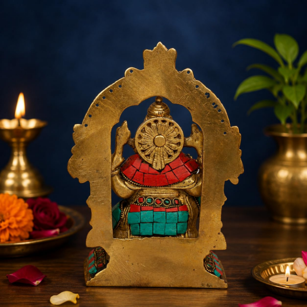 Brass Ganesha Idol measuring 7 inches high with ornate Prabhavali stonework and sturdy design