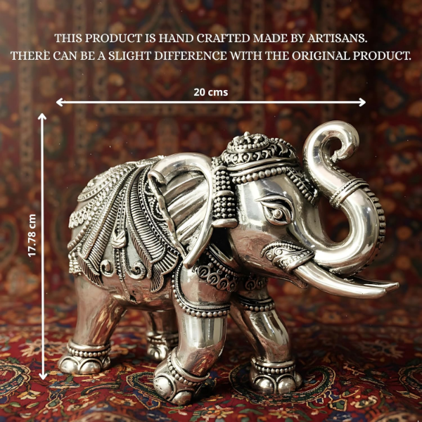 Silver plated elephant idol pair arranged as auspicious Vastu statues for a serene altar at home