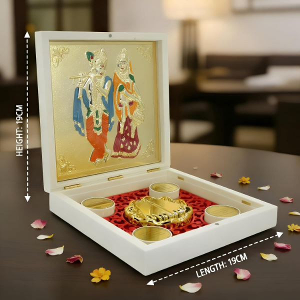 Radha Krishna yantra box showing gold and silver-plated relief with sacred Charan Paduka inside