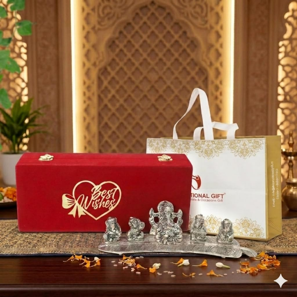 Silver plated Ganesha idols showing musical poses, leaf bases and a bright silver finish for décor