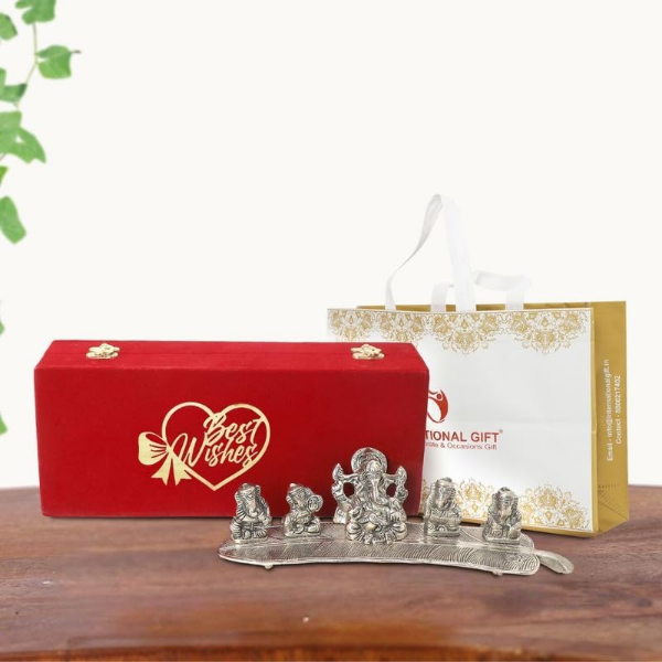 Silver plated Ganesha idols presented as a five-piece musical Ganesh gift set for home display